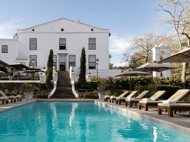 Pool and manor house facade