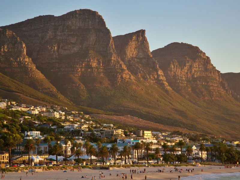 Golden-hour view of the Twelve Apostles above Camps Bay beach and the hotel