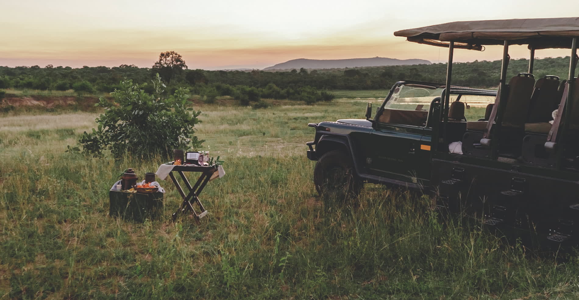 A sundowner beside a game vehicle in the bushveld at Mdluli