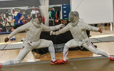 Two people fencing