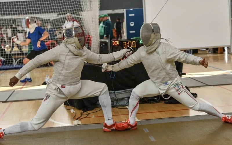 Two people fencing