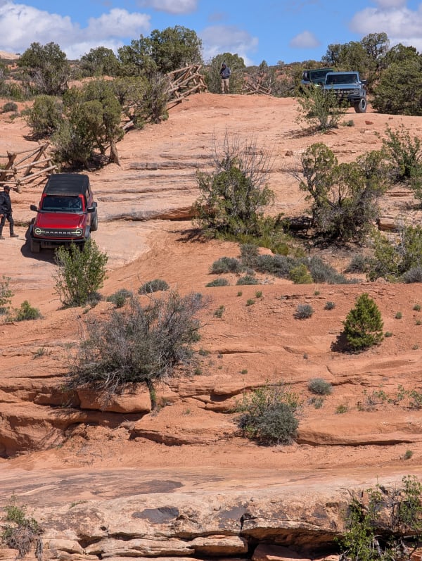 Bronco driving down steeper rocks