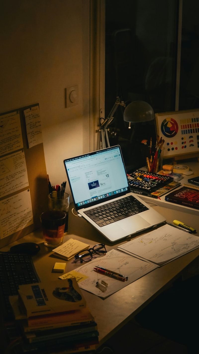 Student studying NCLEX practice questions on laptop