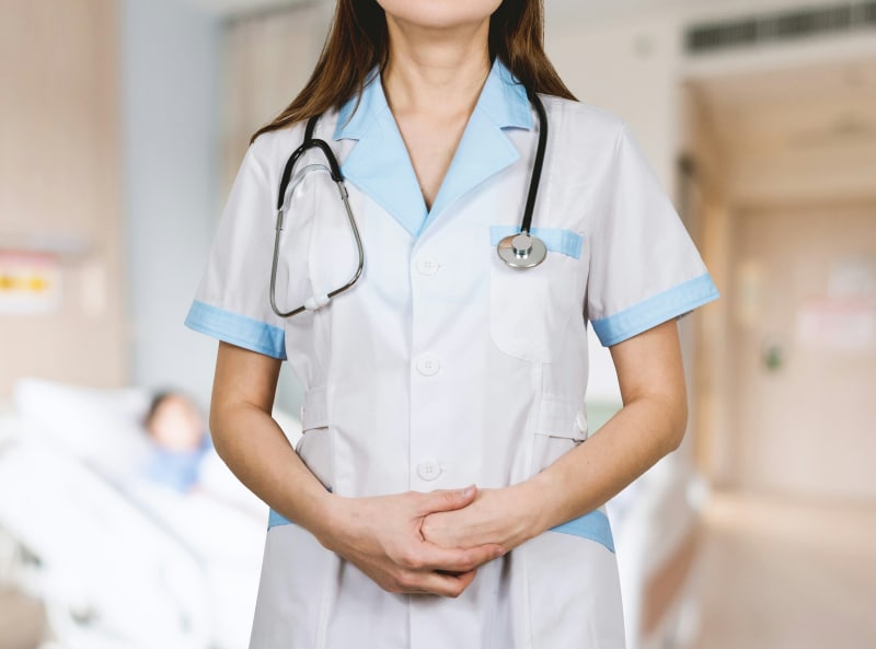Confident doctor in hospital setting preparing for AMC Clinical OSCE