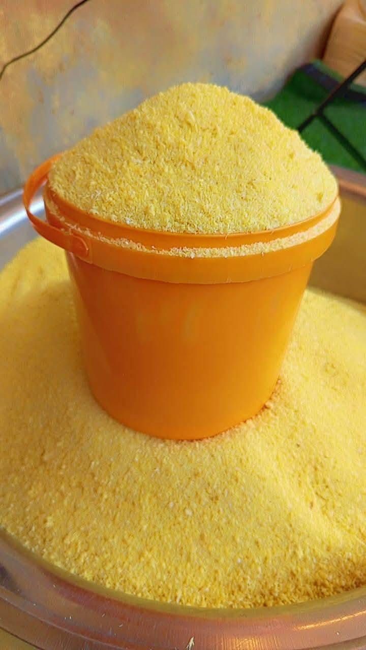 Paint bucket of yellow garri