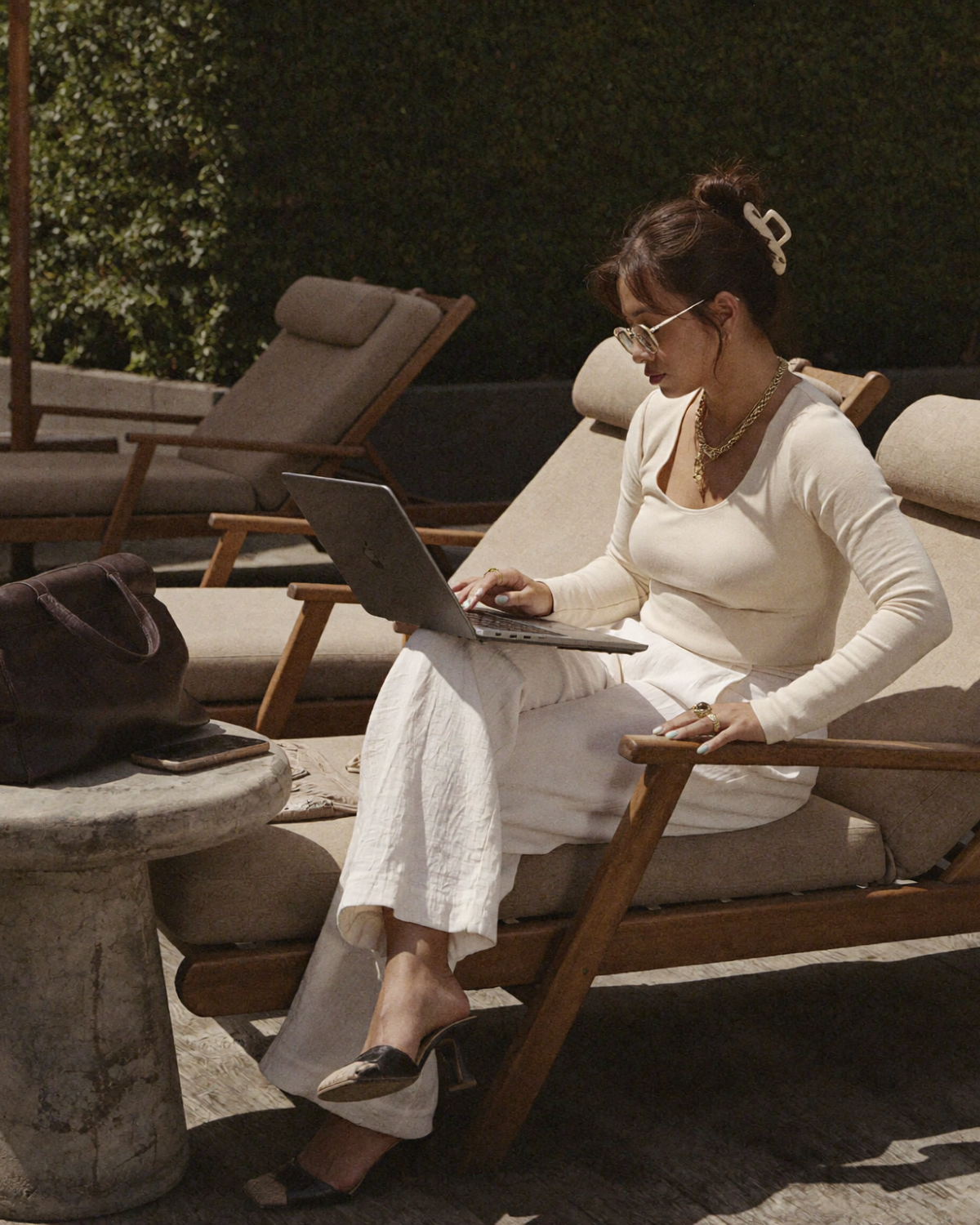 Founder working outdoors on a laptop