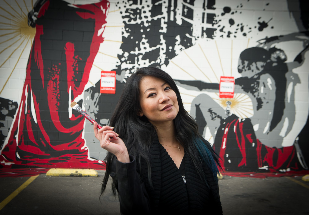 Artist Missy M at location of her mural, Dream of Something Beautiful, in Oakland Chinatown.