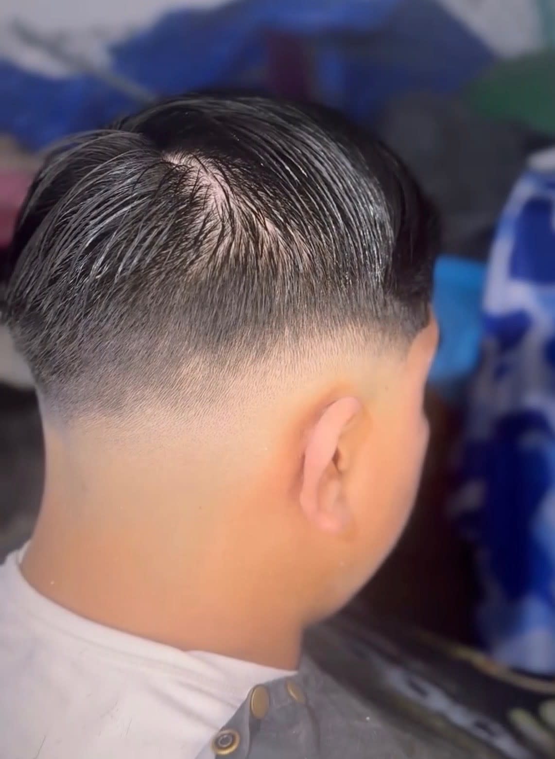 Man with a buzz cut and a high fade