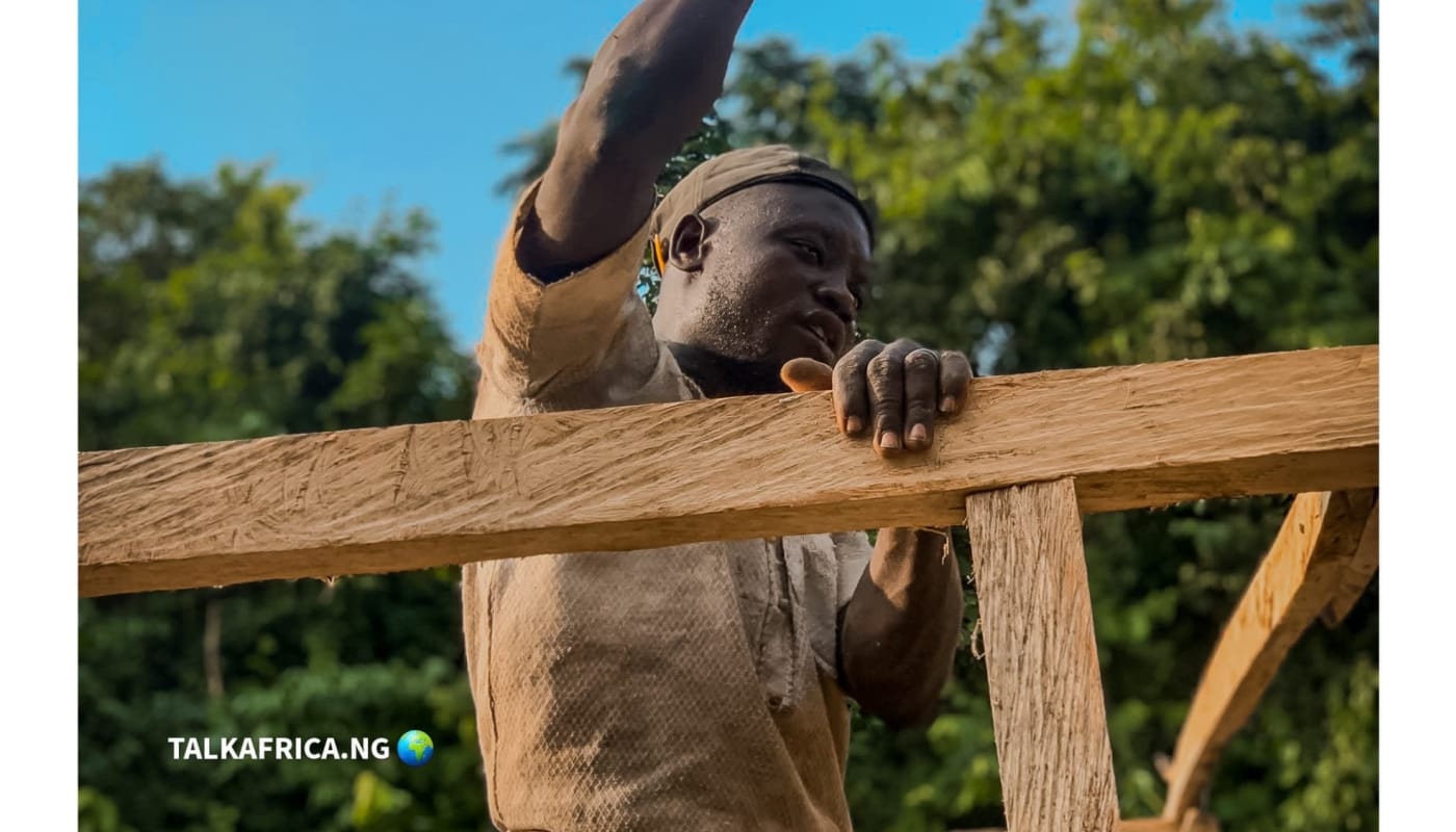 Adebayo — a young carpenter hustling in the city of Lagos