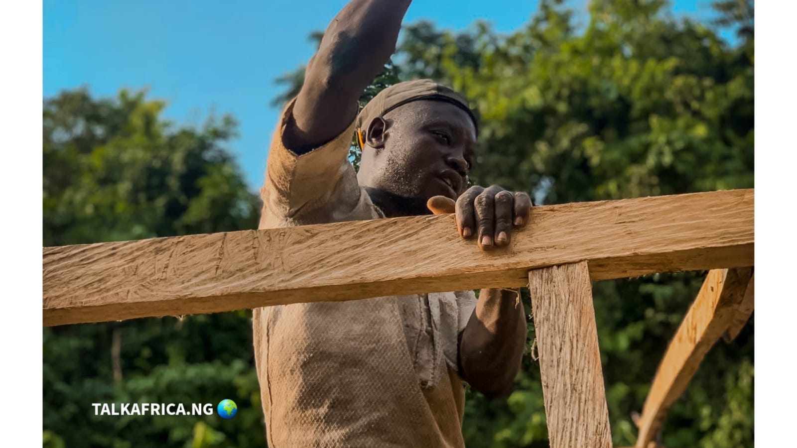 Adebayo — a young carpenter hustling in the city of Lagos