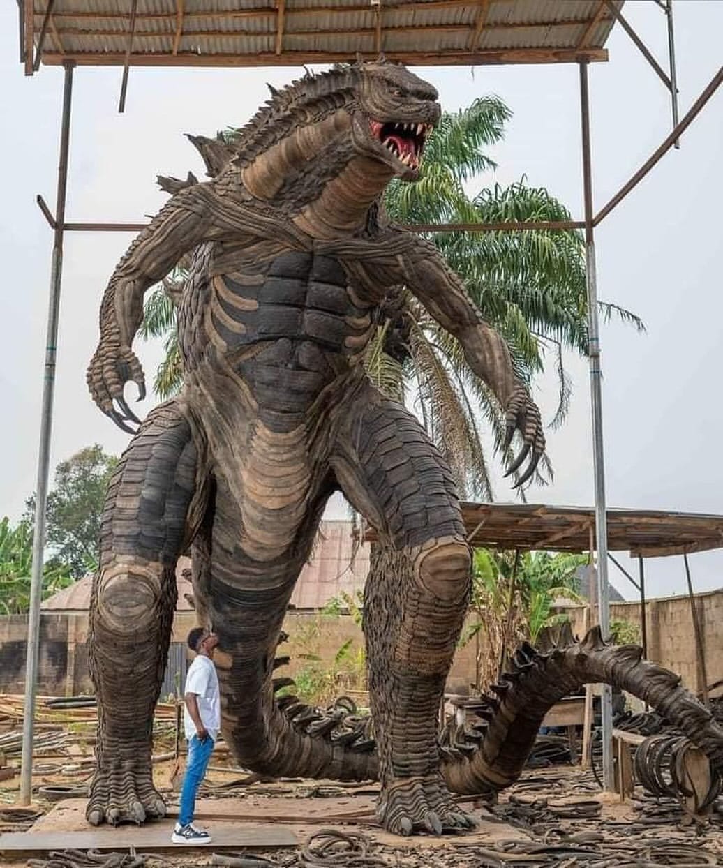 From Waste To Wonder: The 24-Foot Godzilla Built From Recycled Tires In Nigeria