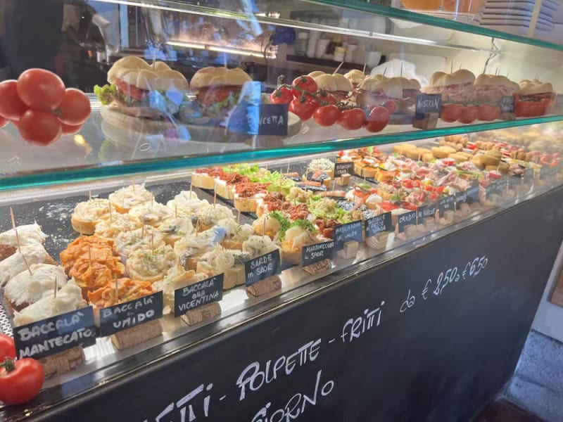 Glass case display of Cicchetti in Venice, Italy