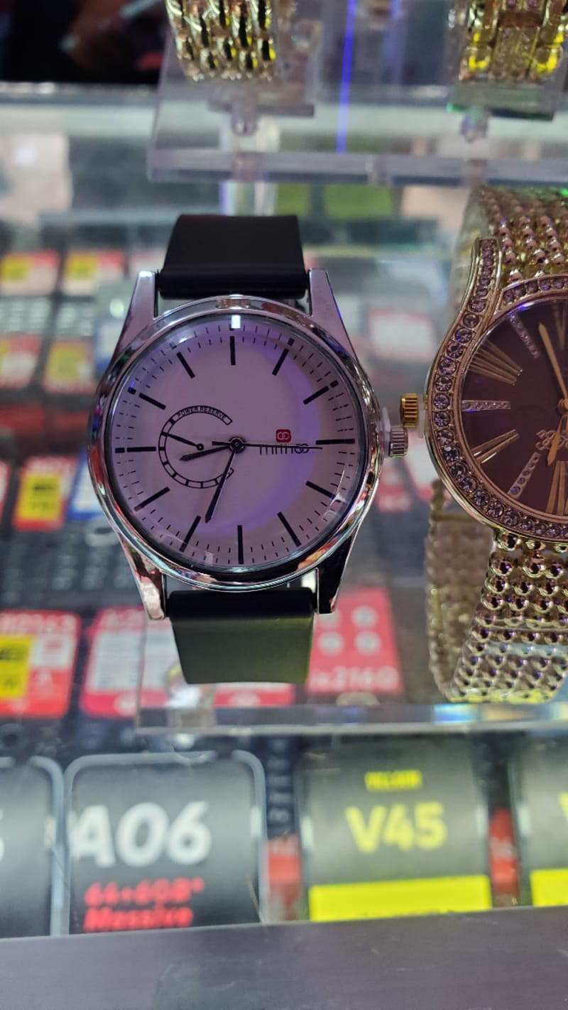 watch at 13000 with rubber and white background belt available in Kabale 