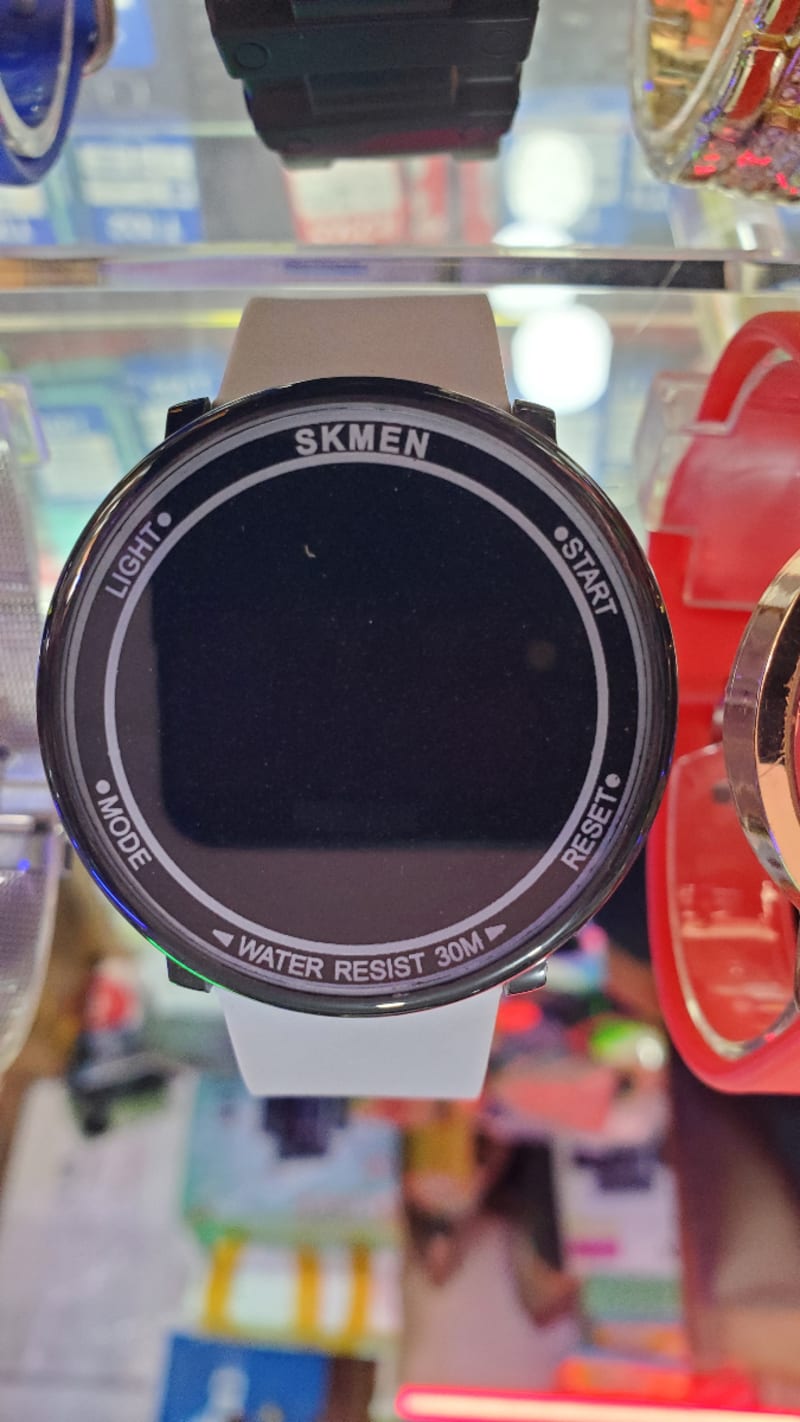 Watch , white  rubber belt , black display  , Water resistant tap to show 