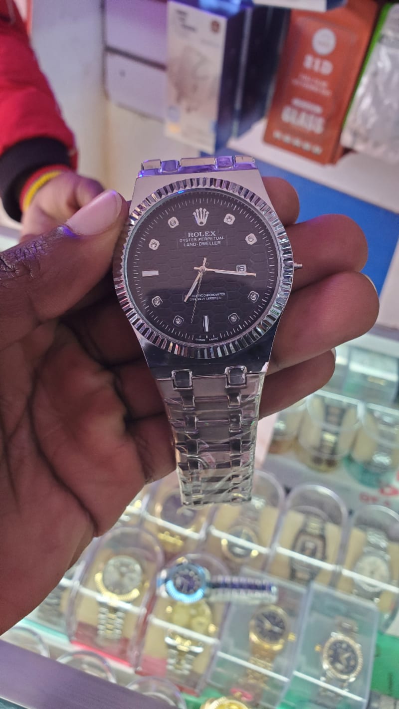 Rolex watch with black display,  dynamic date and time 