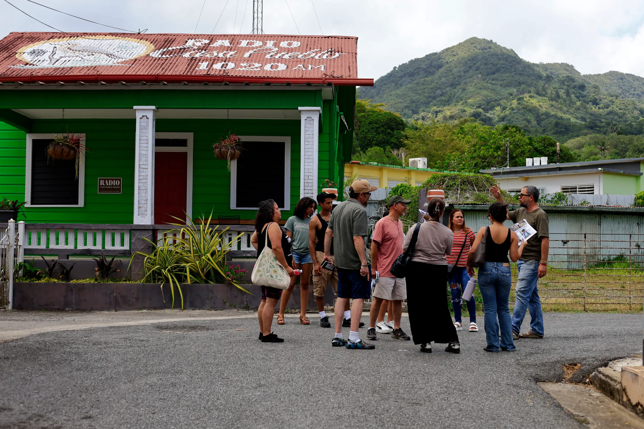 Adjuntas, Puerto Rico, 06/24/2026. Members of the OneHolyoke organization from Massachusetts speak with Arturo Massol, director of Casa Pueblo. | Thais Llorca for The Parlor Magazine