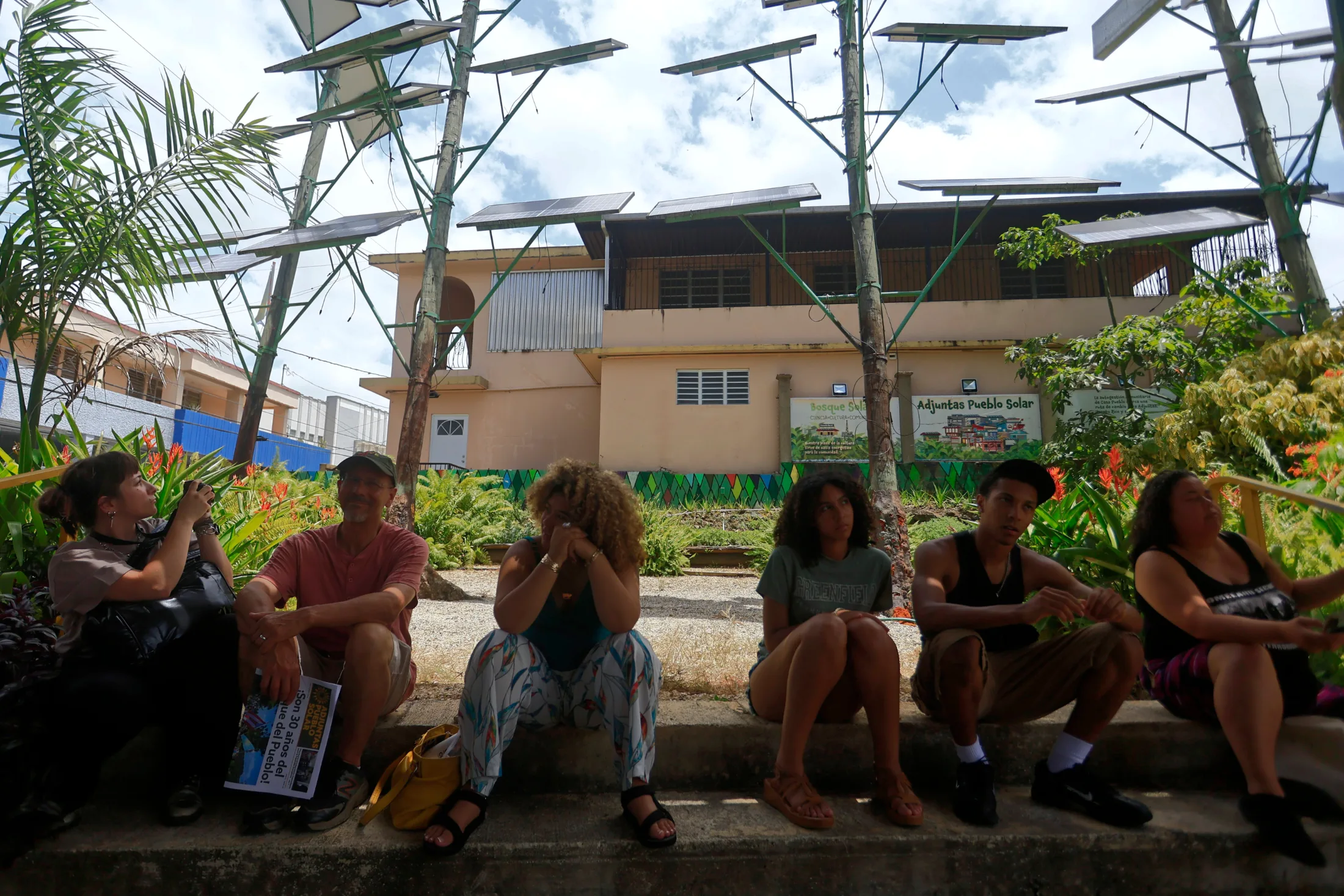 Adjuntas, Puerto Rico, 06/24/2026. Members of the OneHolyoke organization from Massachusetts rest in Casa Pueblo's solar forest. | Thais Llorca for The Parlor Magazine