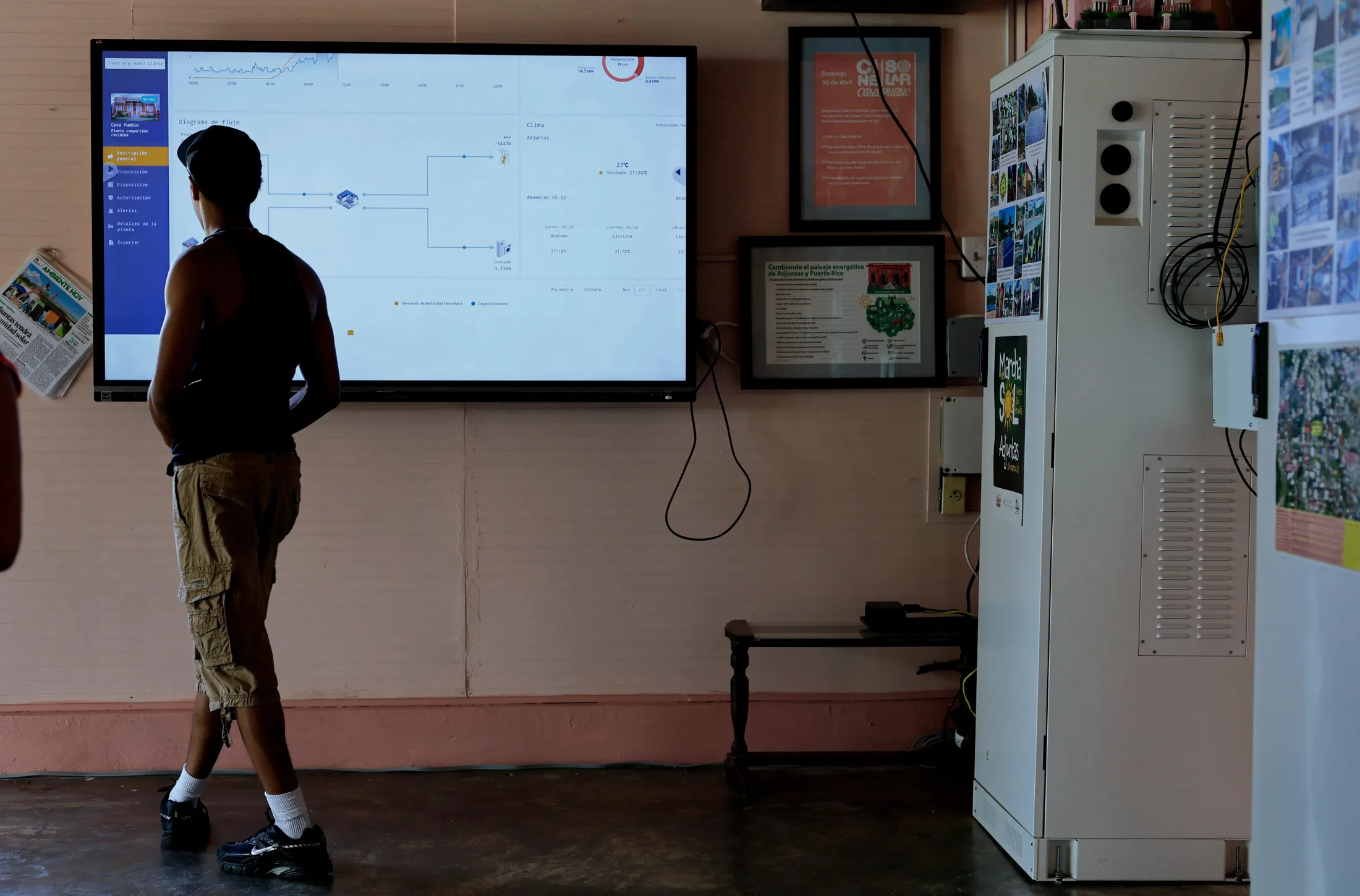 Adjuntas, Puerto Rico, 06/24/2026. Zavier Salomon observes how Casa Pueblo's Microgrid Orchestrator works. | Thais Llorca for The Parlor Magazine