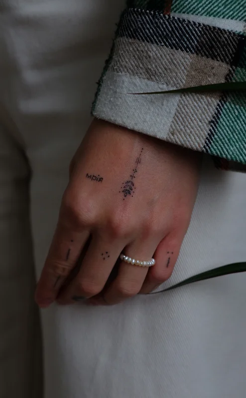 An ear of corn tattoo with inscription Dream