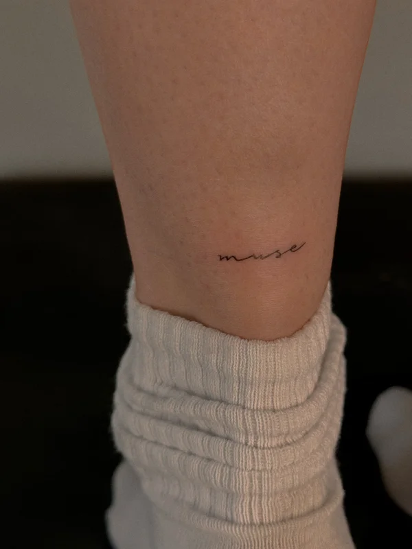 muse tattoo inscription on the leg