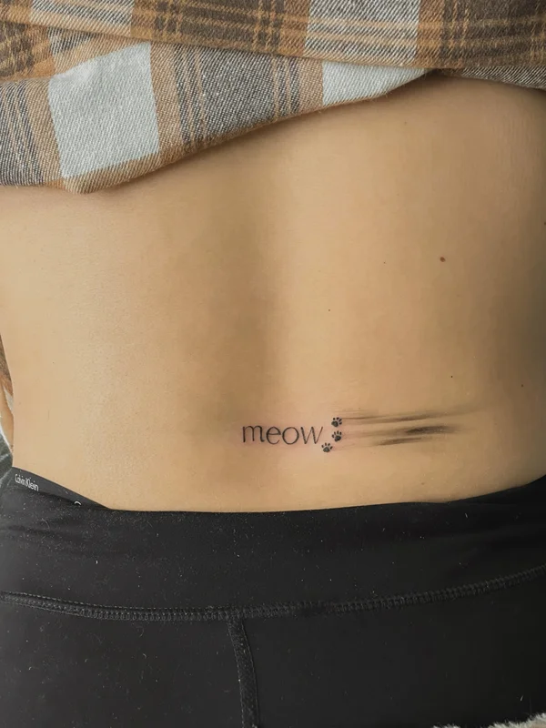 tattoo inscription on the lower back