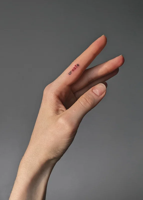Tattoo inscription on the finger Create