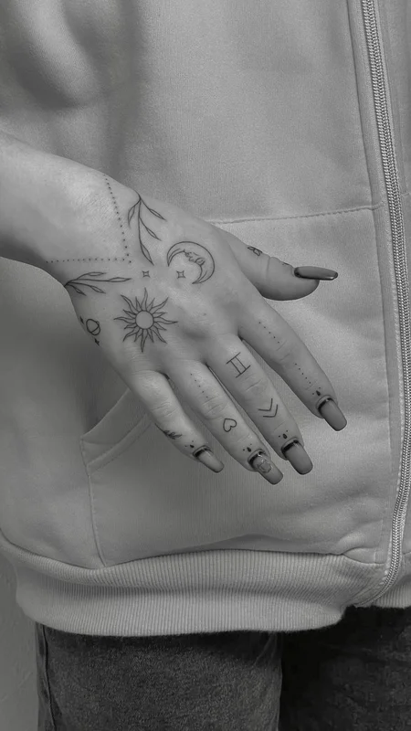 Moon and sun celestial tattoo on the arm
