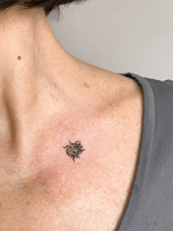 ladybug with hearts mini tattoo