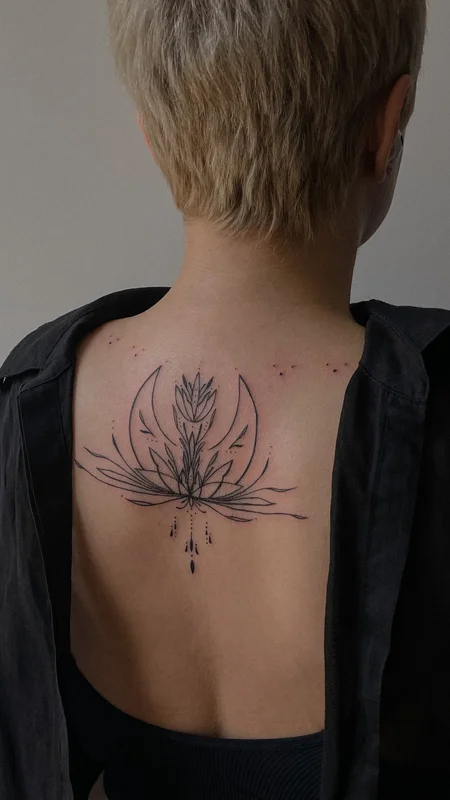 ornamental tattoo on back with moon