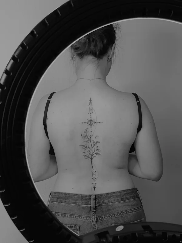 Tattoo ornament with flowers on the back