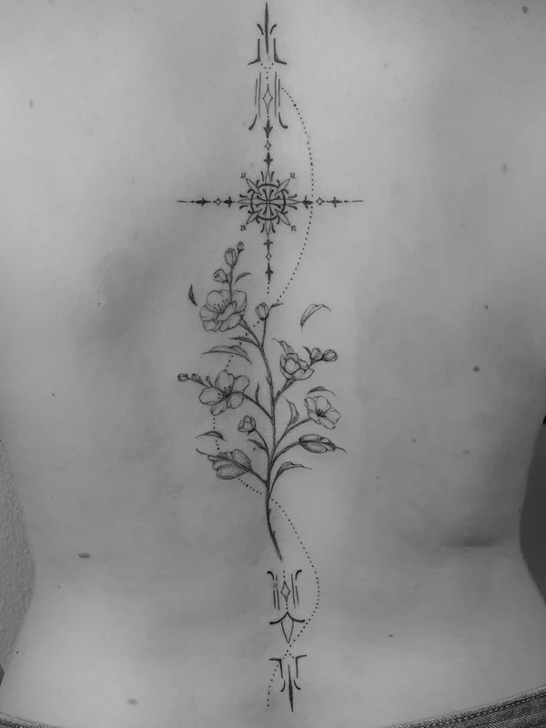 Ornamental tattoo with flowers on the back