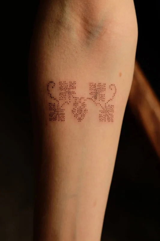 Dotted ornament tattoo