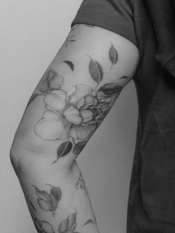 Peony tattoo on shoulder