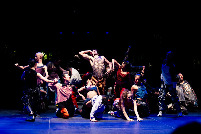 Woman in yellow holding flowers