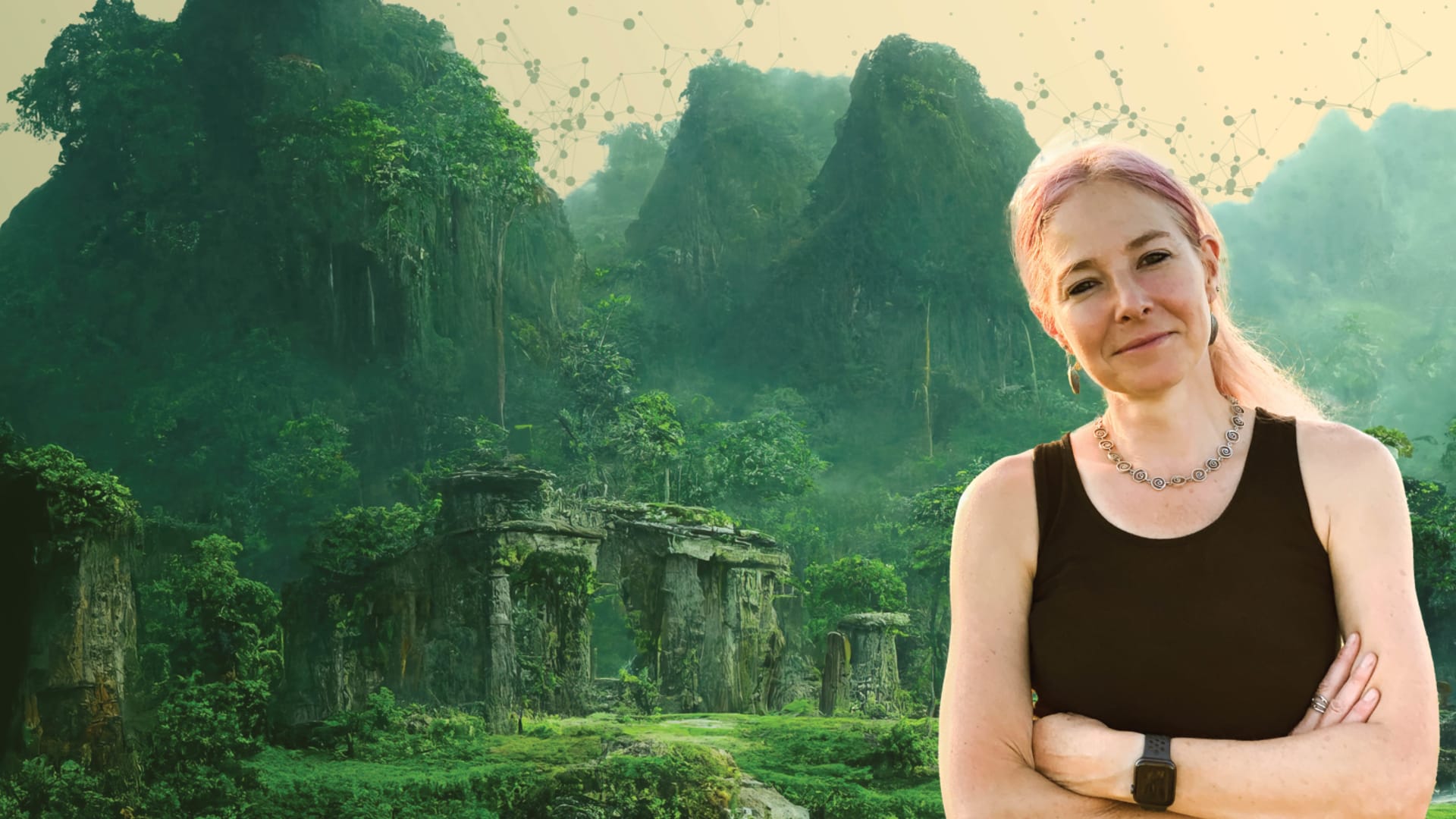 A person with pink-tipped hair in a black sleeveless top stands arms crossed before a background of misty jungle mountains and stone ruins.