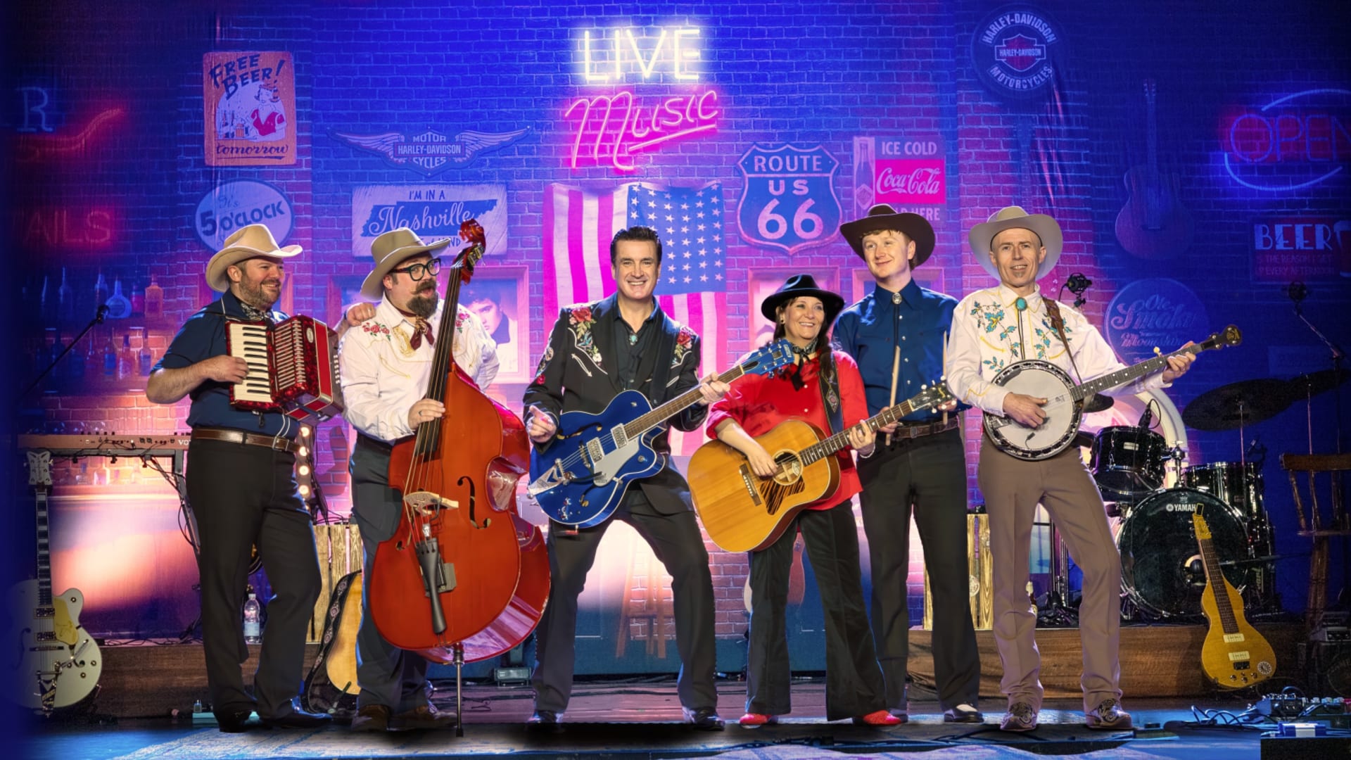 Band members on a neon-lit stage holding instruments including guitar and double bass.