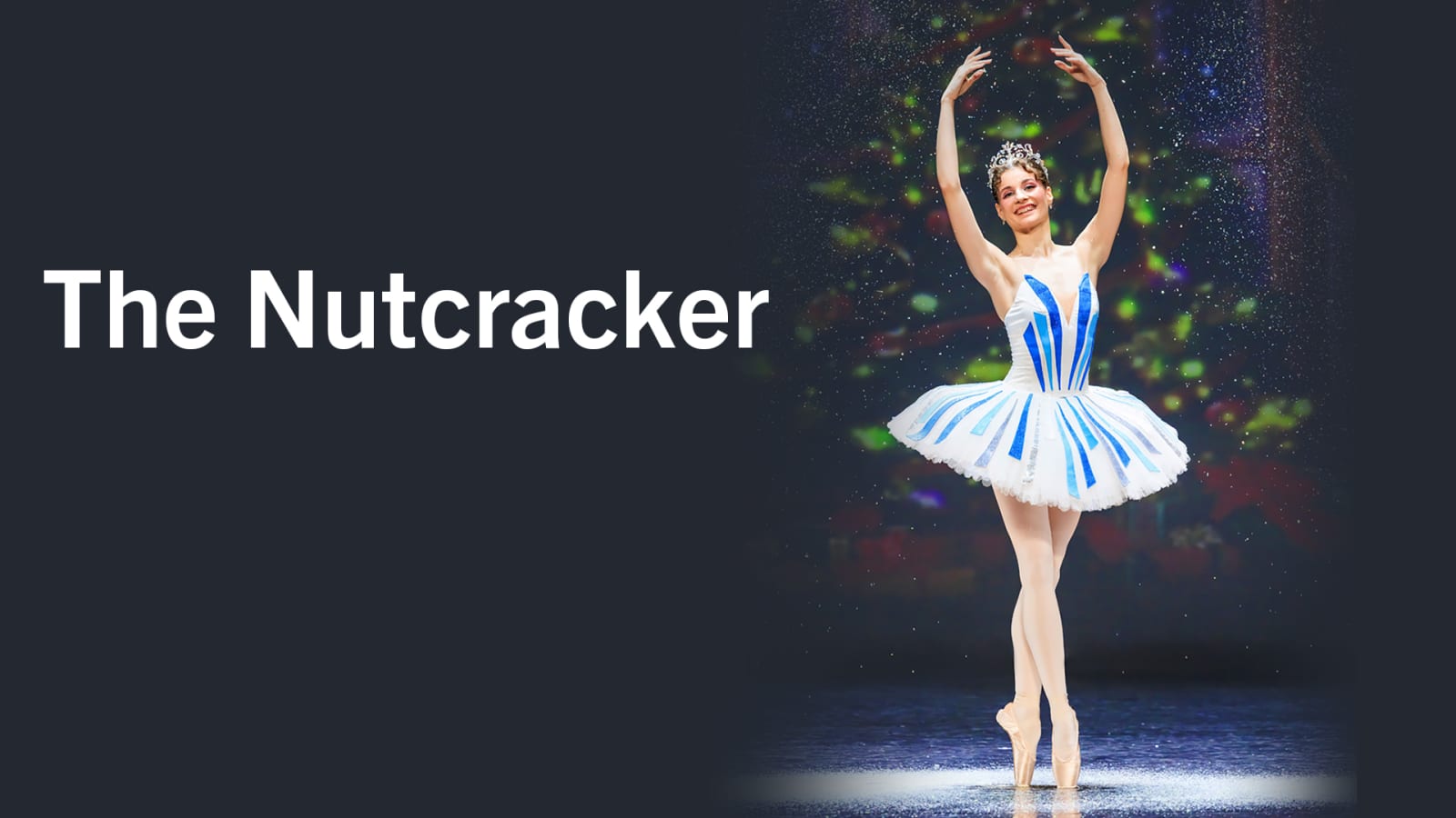 Promotional image with white text reading 'The Nutcracker' on a dark grey panel beside a ballet dancer in a white and blue tutu on pointe, with sparkle effects and blurred colours behind.