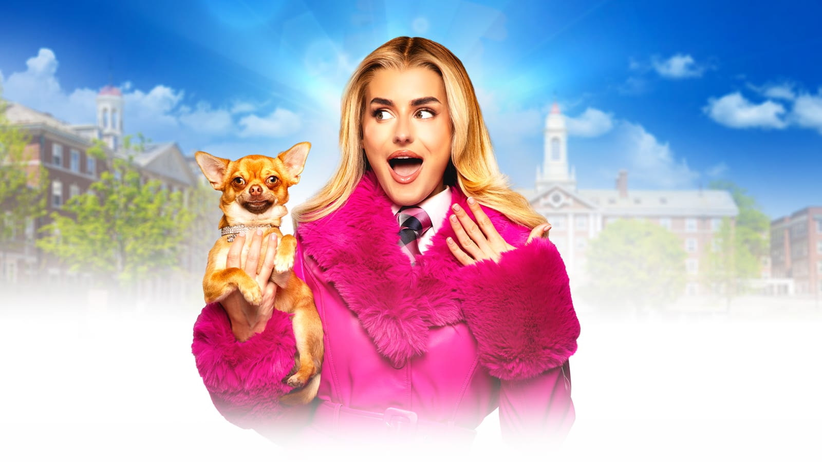 A performer in a bright pink faux-fur trimmed coat holds a small tan chihuahua wearing a diamanté collar, posed against a blue sky backdrop with red-brick university buildings.