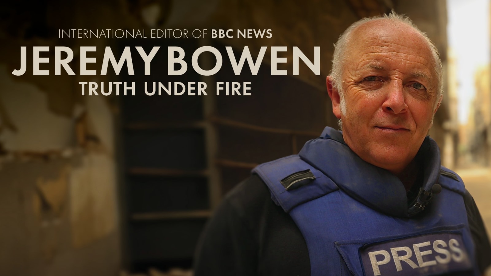 Promotional poster for Jeremy Bowen: Truth Under Fire showing a figure in a blue press body armour vest on a blurred urban street.