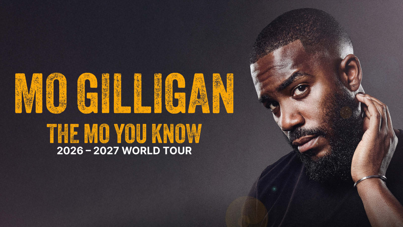 Tour promotional graphic reading 'MO GILLIGAN, THE MO YOU KNOW, 2026–2027 WORLD TOUR' in bold yellow distressed lettering on a dark background.