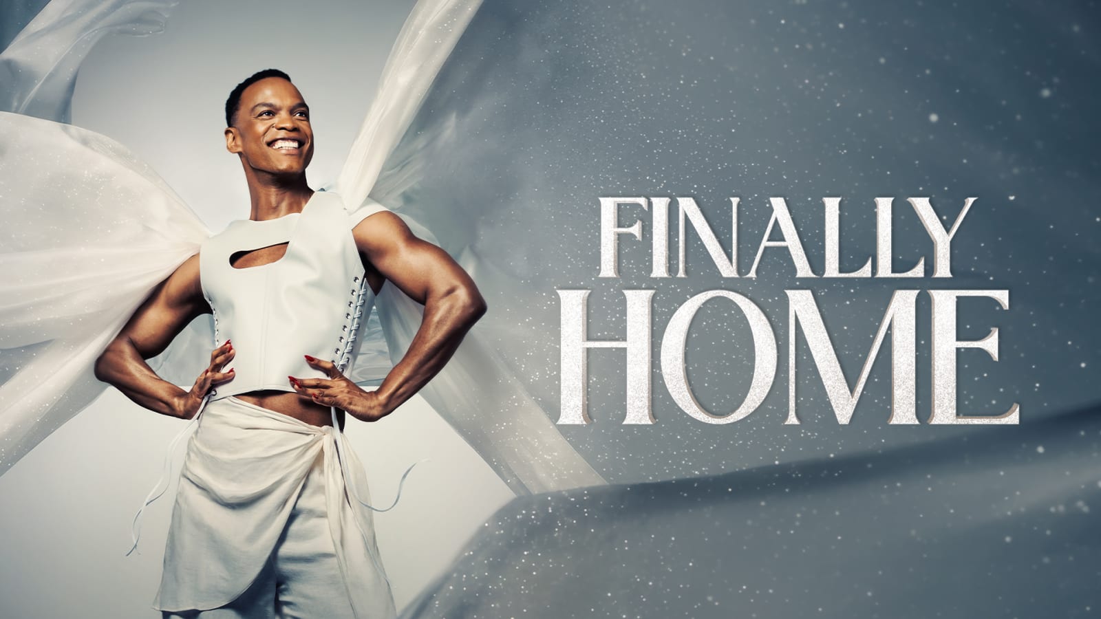 A performer in a white corset top and pale wrap skirt poses against sweeping white fabric on a grey sparkled background beside silver glitter-effect title text reading Finally Home.