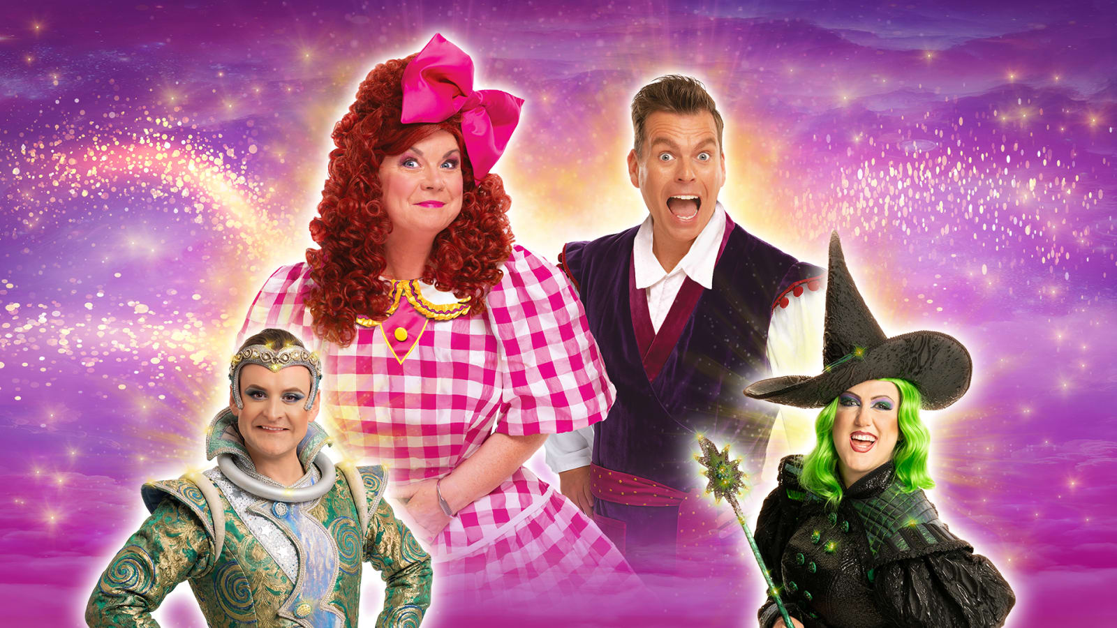 Four pantomime performers in costume against a purple and gold sparkle background.