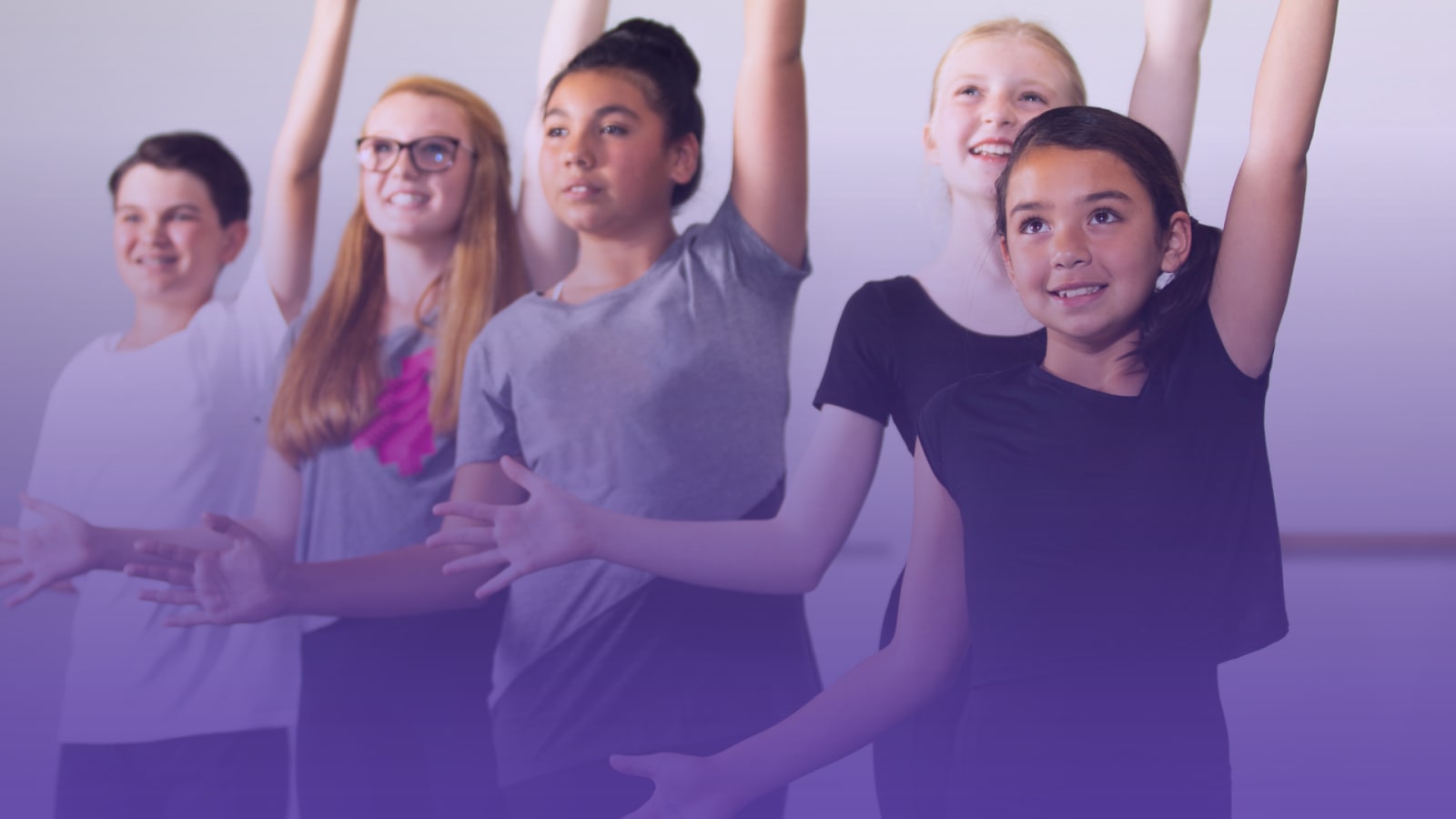 Five young people in a dance studio raising one arm upward in a coordinated movement, wearing casual t-shirts against a light grey background with a purple colour overlay.