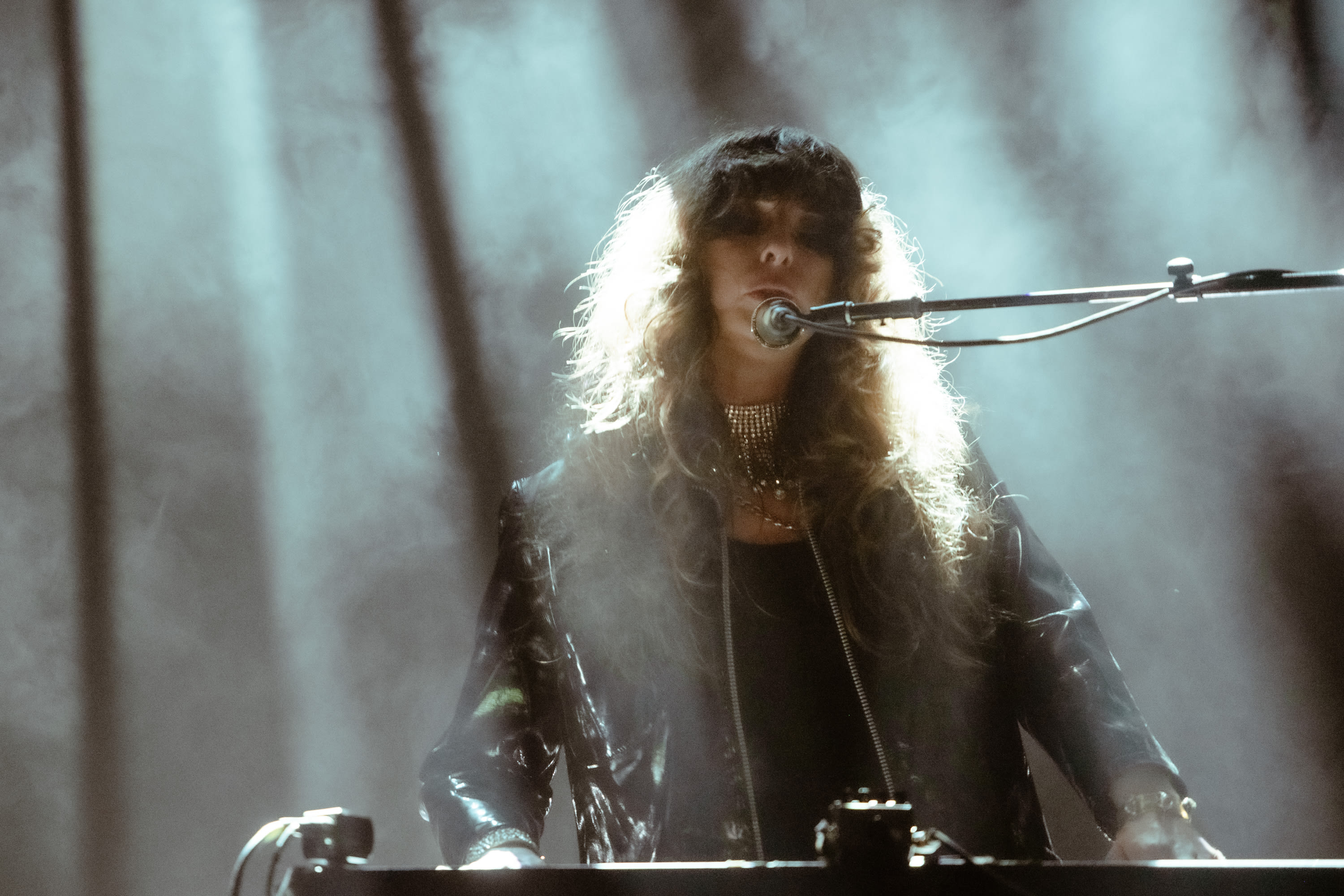 person playing piano and singing