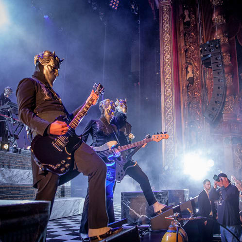 Ghost event with three people playing guitar