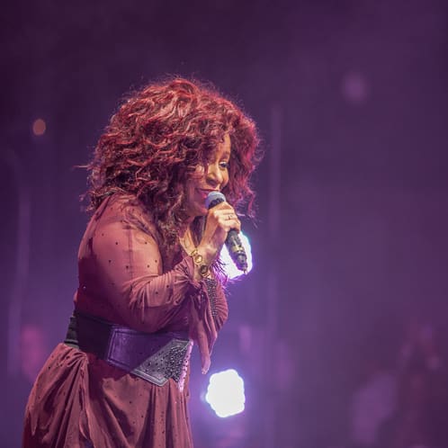 woman singing on stage