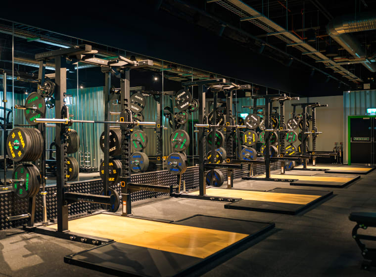 The lifting hall at XF Manchester, squat racks in a row