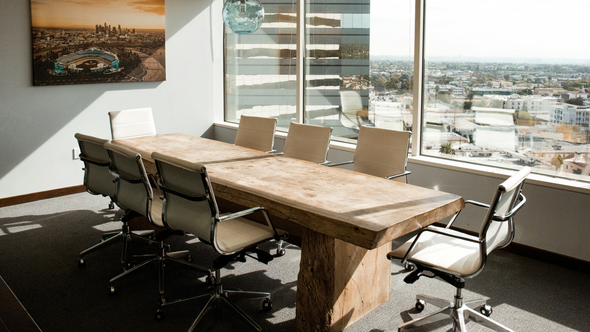 Law-firm conference room with a city view — ClaireAI answers Spanish-speaking callers on the first ring