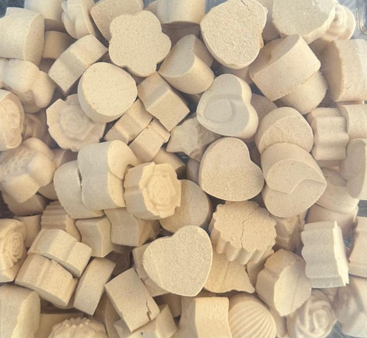 Smooth heart-shaped Baobab Sweets on neutral background