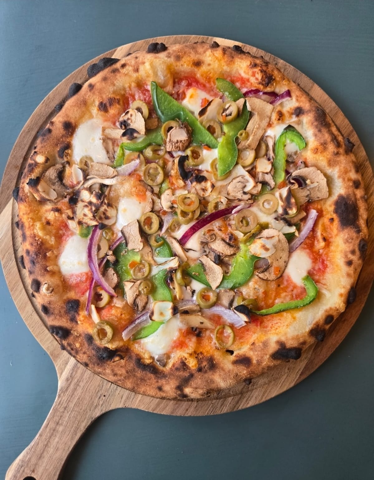 Bella Giardino pizza with wild mushrooms, olives, onion, and peppers
